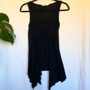 Gibson - Flowy Black sleeveless top, floral gathers at the waist. Shark bite hem